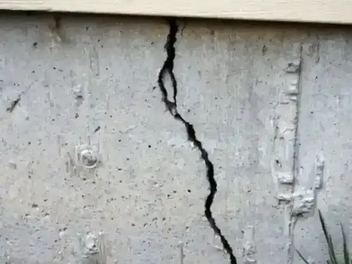 large vertical crack in poured concrete foundation