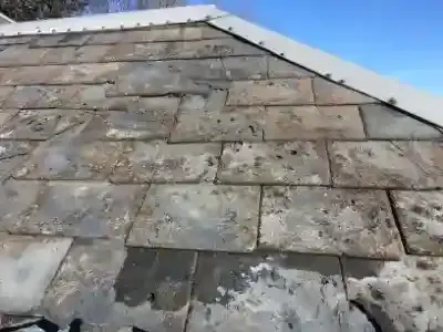 storm damage to slate roof
