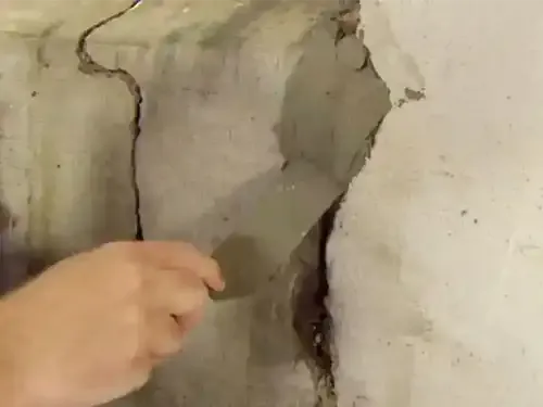 tuck point poured concrete foundation crack